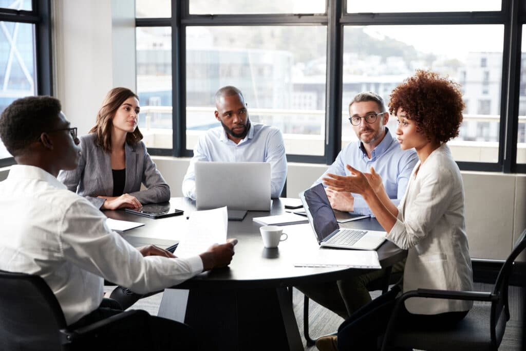 Businesswoman addressing colleagues in a conference room